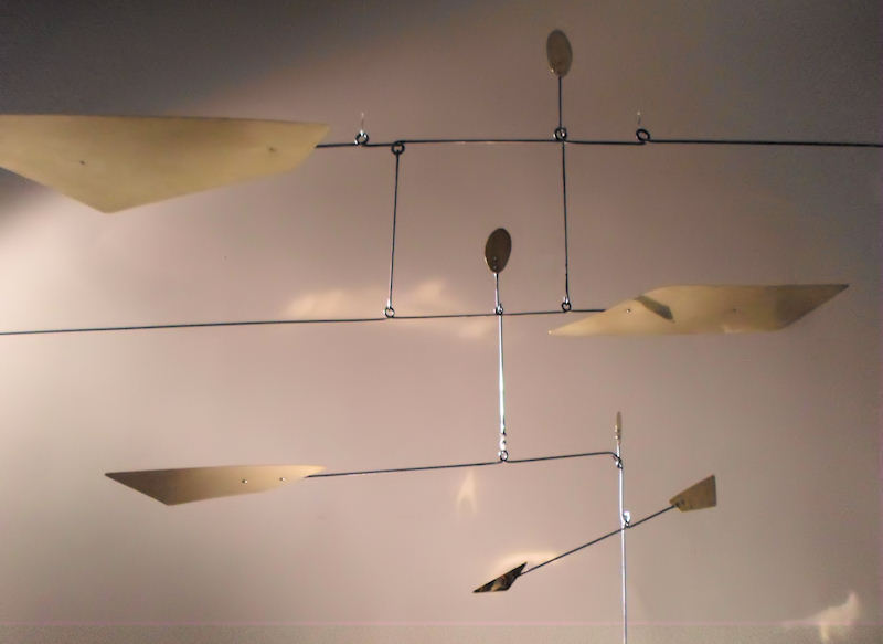 Photo of Custom Mobiles made with Brass for a Conference Table